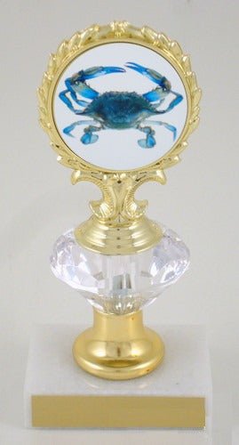 A trophy featuring a blue crab illustration on a diamond figure mount with a white marble base.