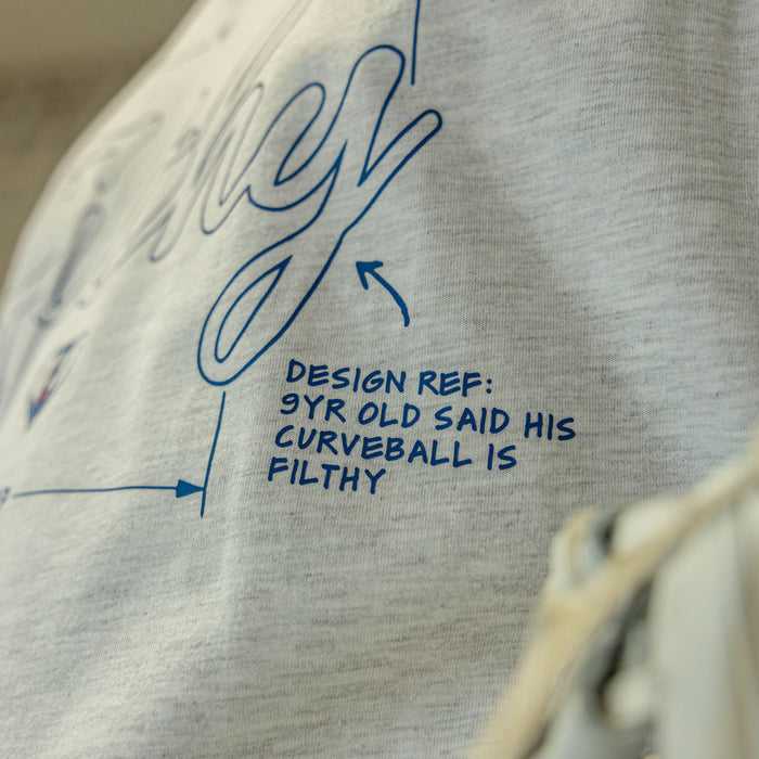 Gray sweatshirt with blue text and design elements on a blurred background