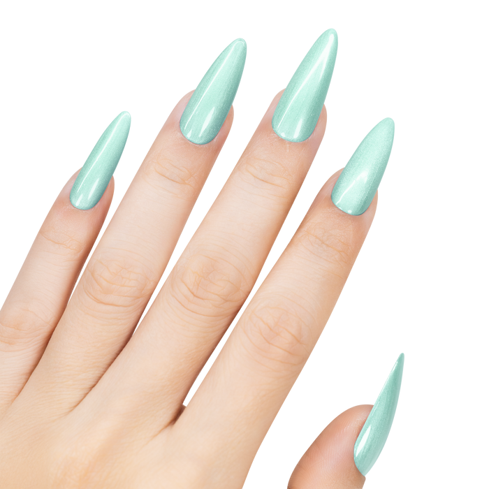 Hand with light green stiletto nails on a white background