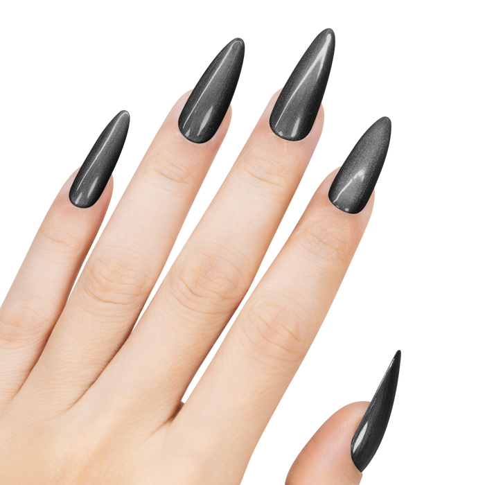 Hand with black stiletto nails on a white background