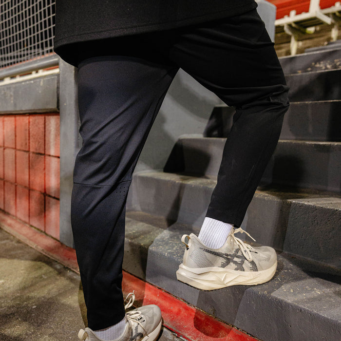 Youth model wearing black Pro Series Active Pants youth pants