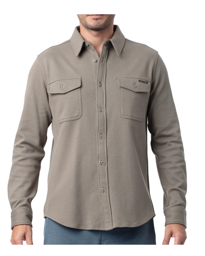 Men's taupe long-sleeve button-up shirt with two chest flap pockets and curved hem.