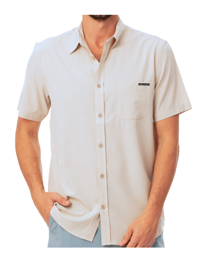 Front view of the beige Horizon Tech Short Sleeve Button Down showcasing its relaxed fit, chest pocket, and button front on a white background