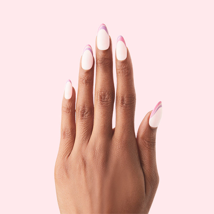 Twisted French - Press-On | Long | Almond showing hand with long almond false nails in white base and pink swirl twist design manicure