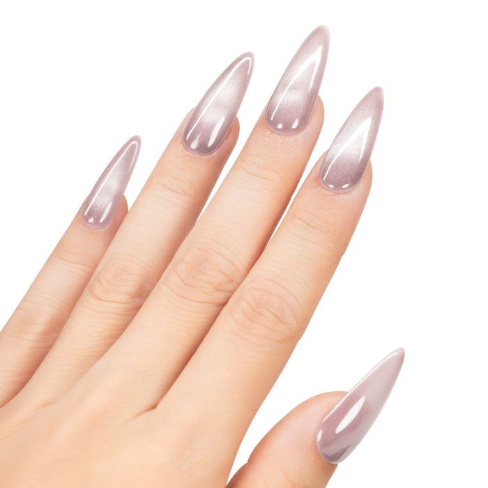 Hand with stiletto nails featuring a light pink color on a white background