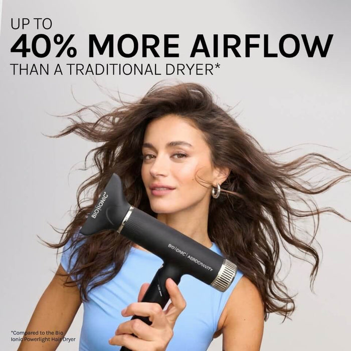 Woman using a hair dryer with text highlighting increased airflow.
