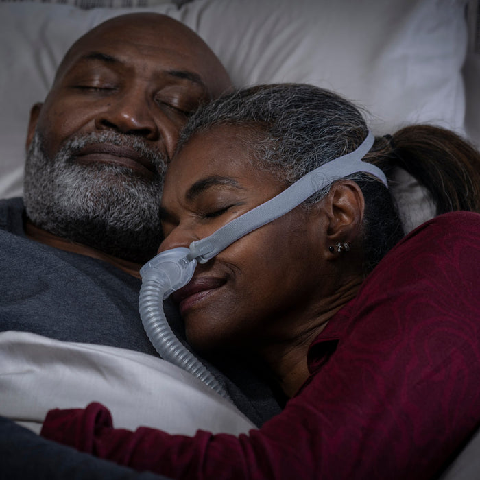 Man sleeping with an Airlift P10 Nasal Pillow CPAP mask