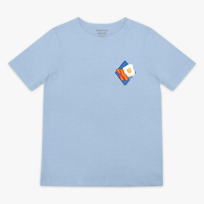Light blue t-shirt with a graphic of an egg and bacon on a white background