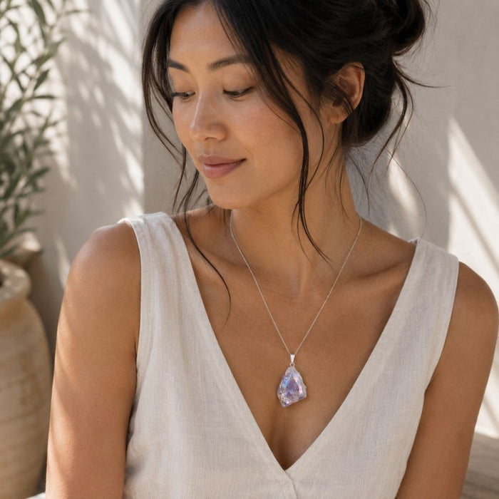 Woman Wearing an Aura Amethyst Raw Crystal Pendant with Silver Bail Necklace
