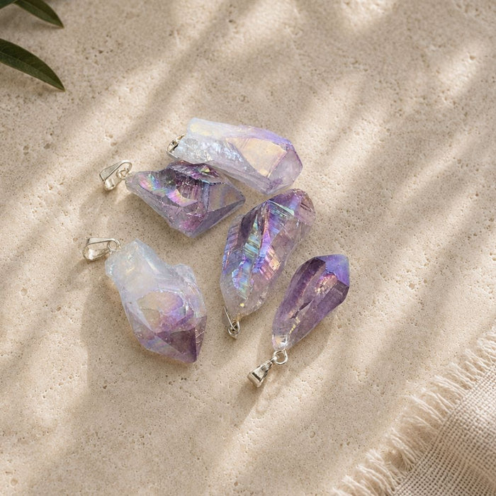 Aura Amethyst Raw Crystal Pendant with Silver Bail on Natural Travertine Background