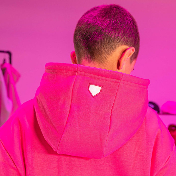 Youth model wearing pink Baseline youth hoodie