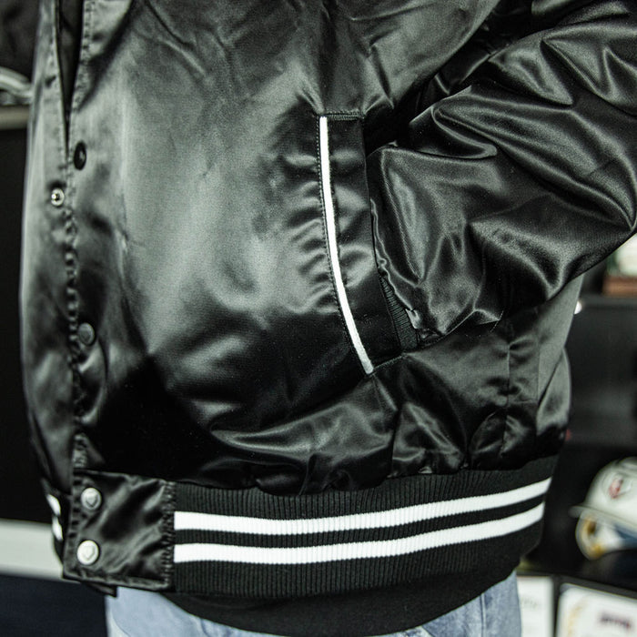 Jacket with “Baseline Satin Jacket” design — front view