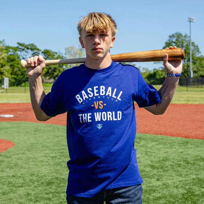 Adult model wearing navy graphic tee with "BL101 Vs The World" design