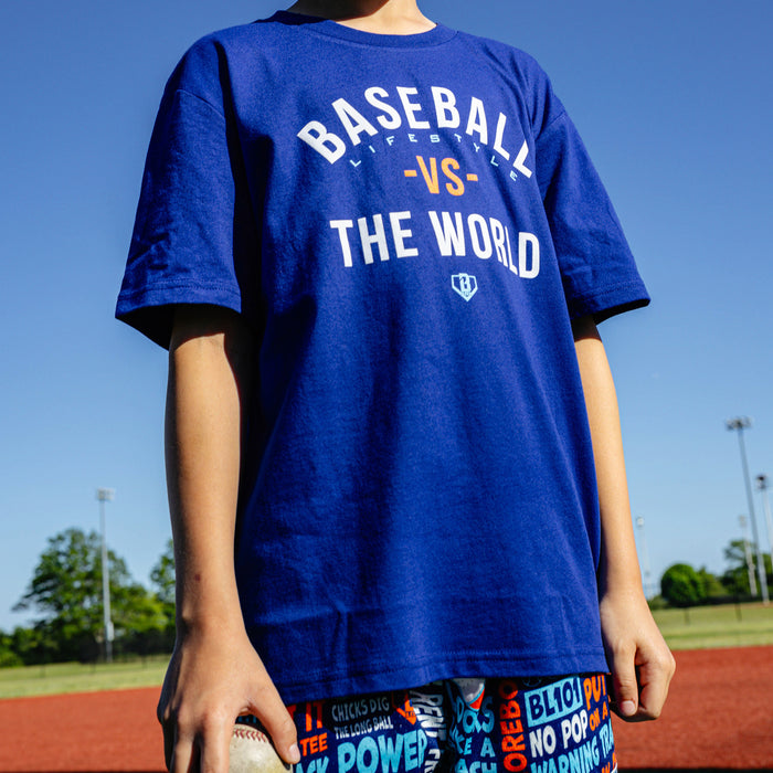 Youth model wearing navy youth graphic tee with "BL101 Vs The World Youth" design