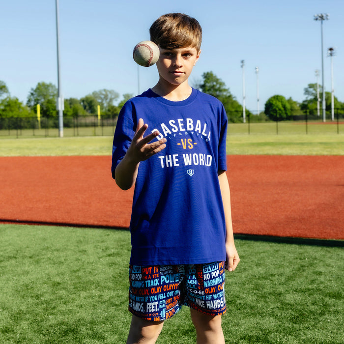 Youth model wearing navy youth graphic tee with "BL101 Vs The World Youth" design