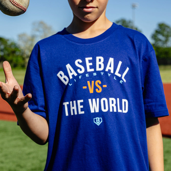 Youth model wearing navy youth graphic tee with "BL101 Vs The World Youth" design