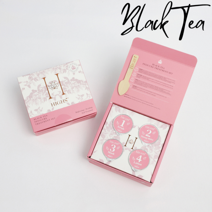 A closed and opened pink floral box displaying pods containing Black Tea Manicure products