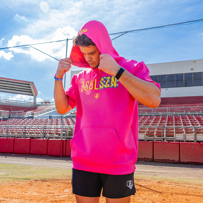 Adult model wearing pink and smiley slugger BSBL-SZN short sleeve hoodie