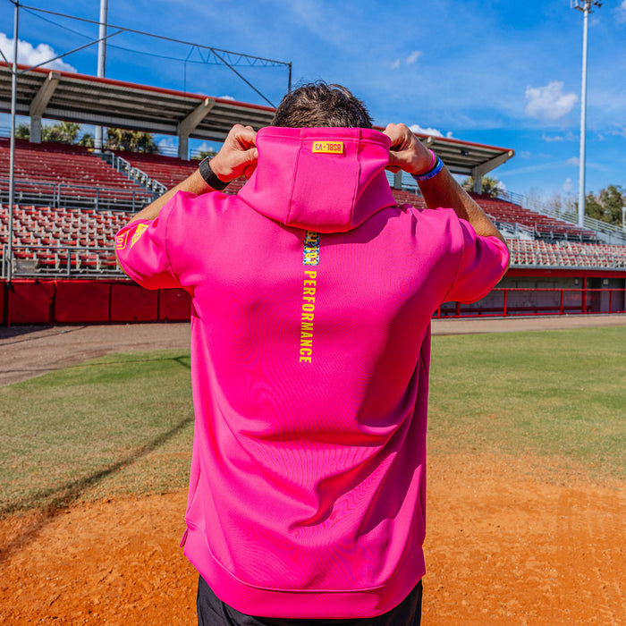 Adult model wearing pink and smiley slugger BSBL-SZN short sleeve hoodie