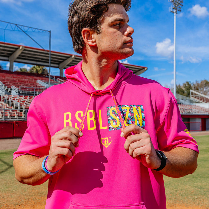 Adult model wearing pink and smiley slugger BSBL-SZN short sleeve hoodie