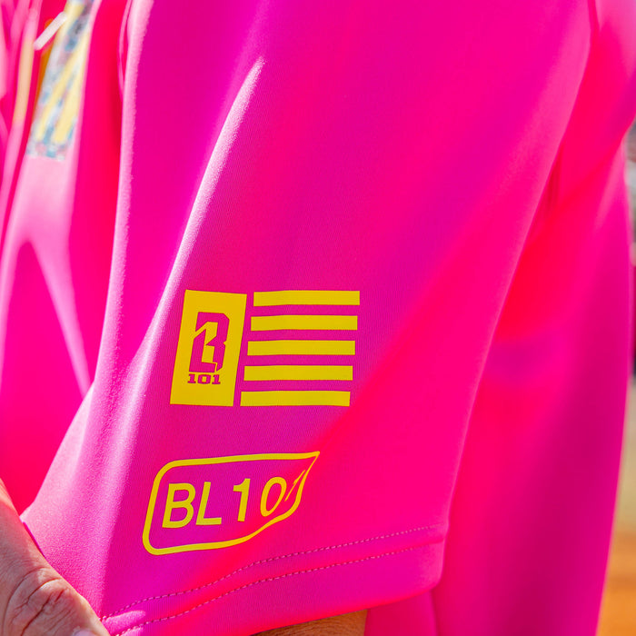 Adult model wearing pink and smiley slugger BSBL-SZN short sleeve hoodie