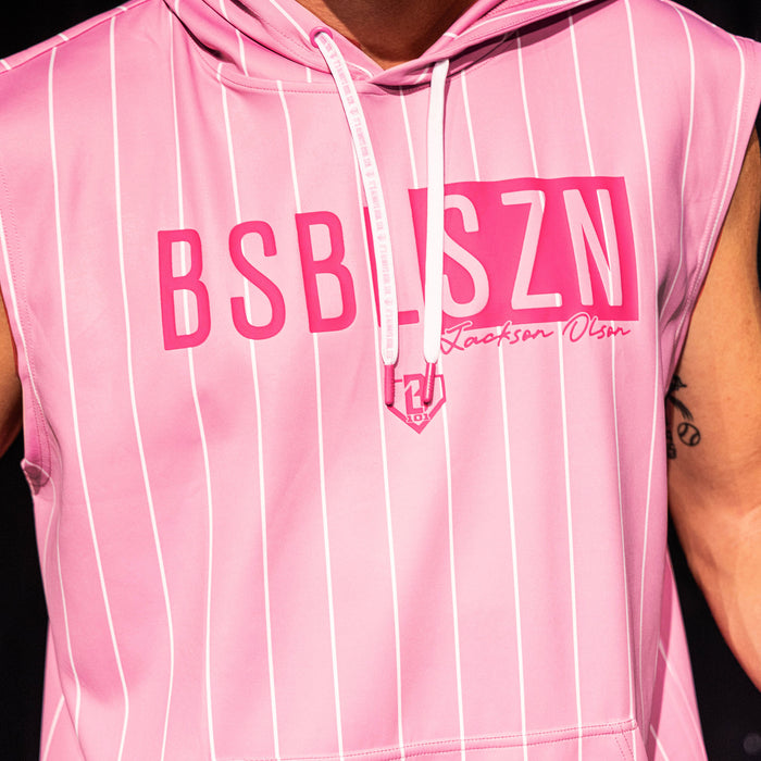 Close-up of the front graphic on the pink pinstripe BSBL-SZN Short Sleeve Hoodie V3, showing the "BSBLSZN" box logo, "Jackson Olson" script, and BL101 home plate icon