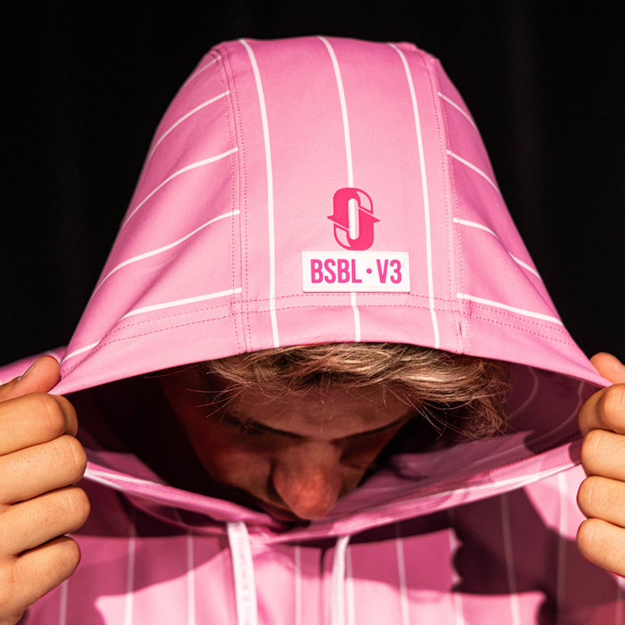 Close-up of the hood on the pink pinstripe BSBL-SZN Short Sleeve Hoodie V3 showing the Jackson Olson "O" logo and "BSBL·V3" label