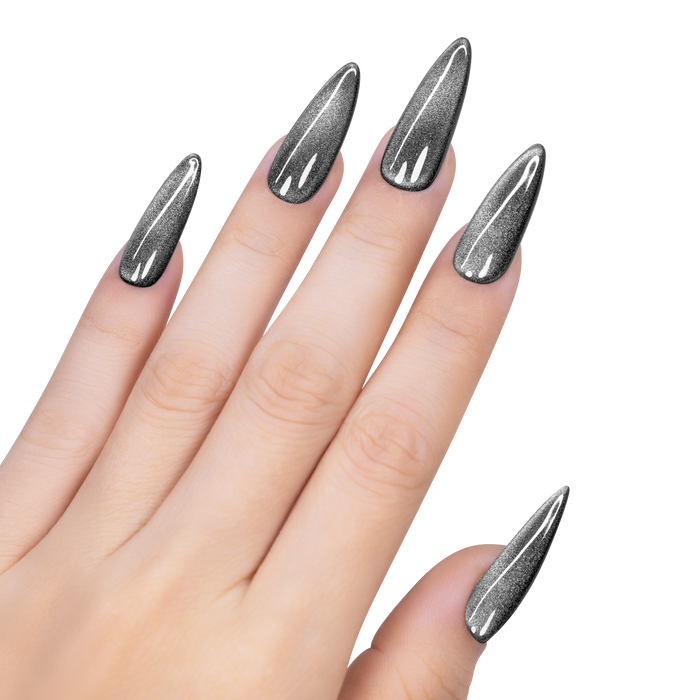 Hand with stiletto nails painted in metallic silver on a white background