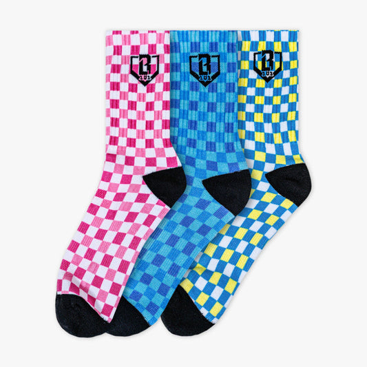 Adult model wearing multi-color socks with "Checker Print Performance  3-Pack" design