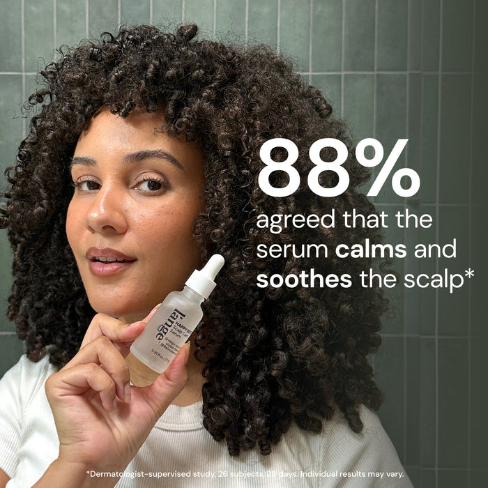 Woman with curly hair holding Scalp Calm Serum with text "88% agreed that the serum calms and soothes the scalp*"

*Dermatologist-supervised study, 26 subjects, 28 days. individual results may vary
