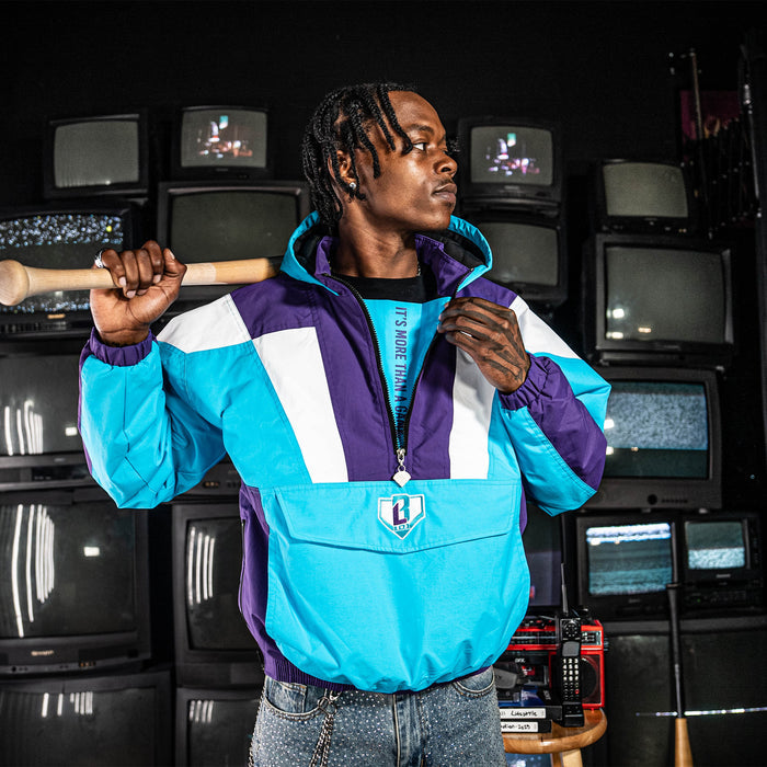 Person wearing colorful jacket with blue, purple, and white design