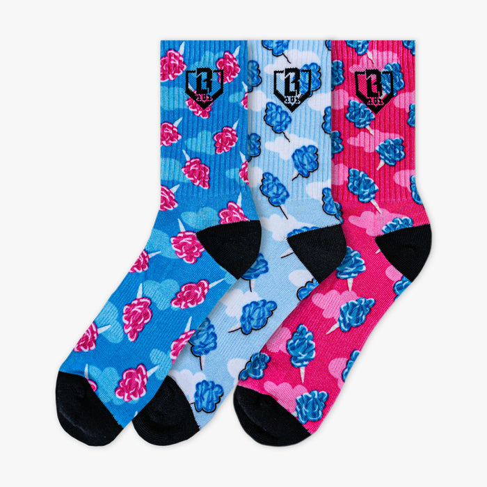 Adult model wearing multi-color socks with "Cotton Candy Performance  3-Pack" design