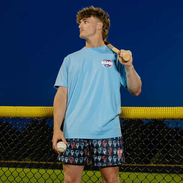 Adult model wearing red, white & blue Cotton Candy Light Blue graphic tee