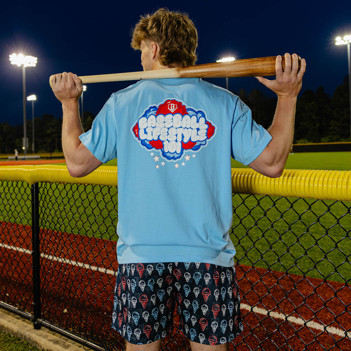Adult model wearing red, white & blue Cotton Candy Light Blue graphic tee