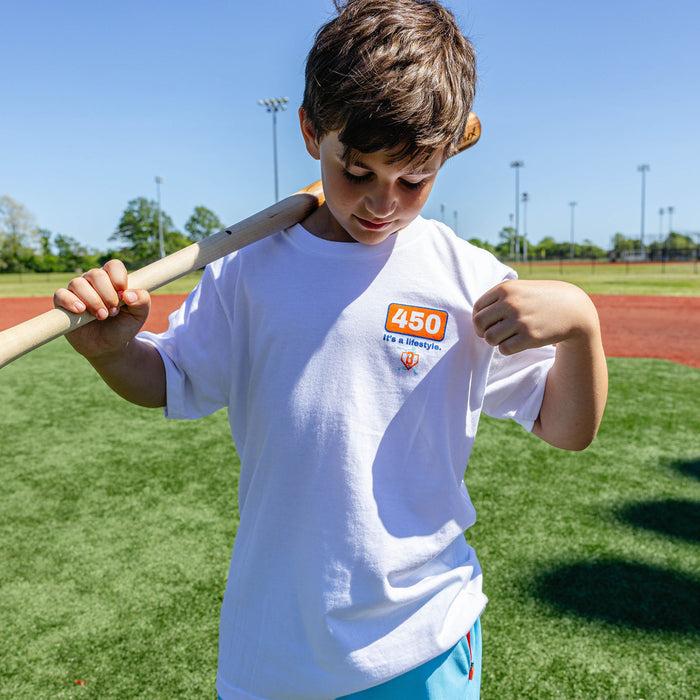 Youth model wearing white youth graphic tee with "Dead Center Youth" design