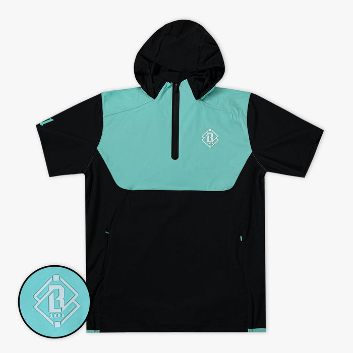 Adult model wearing black and teal Diamond Tech Pro Cage Jacket jacket