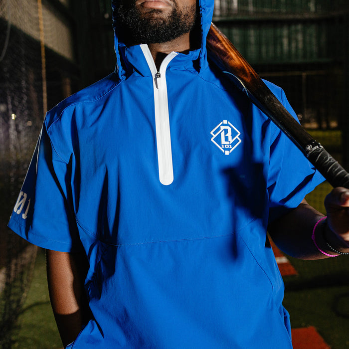 Adult model wearing blue Diamond Tech Pro Cage Jacket Royal Blue jacket