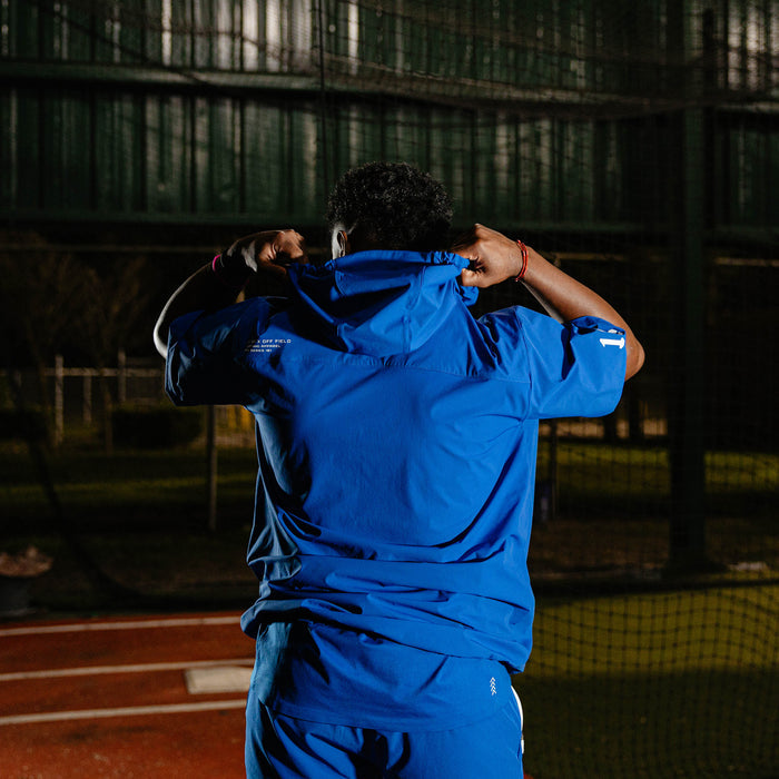 Adult model wearing blue Diamond Tech Pro Cage Jacket Royal Blue jacket