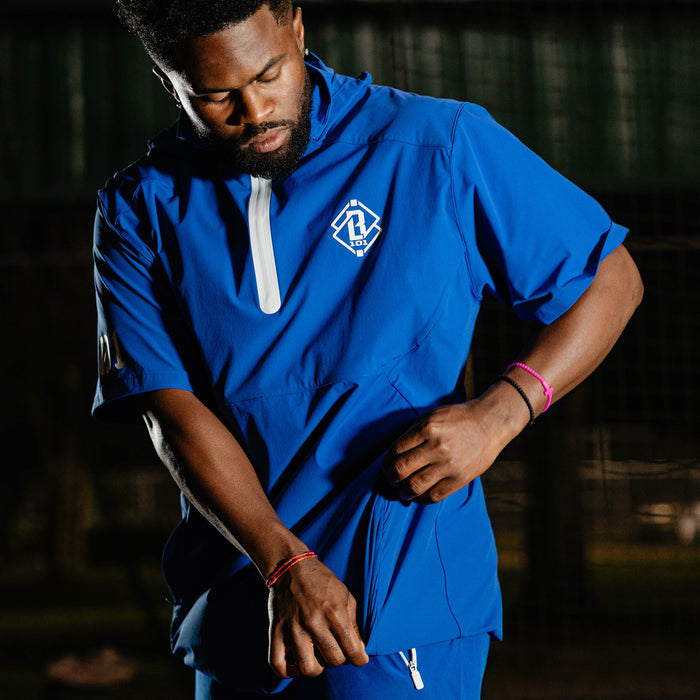 Adult model wearing blue Diamond Tech Pro Cage Jacket Royal Blue jacket