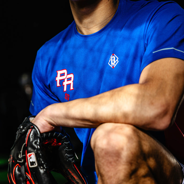 Adult model wearing blue Diamond Tech Vented Puerto Rico graphic tee