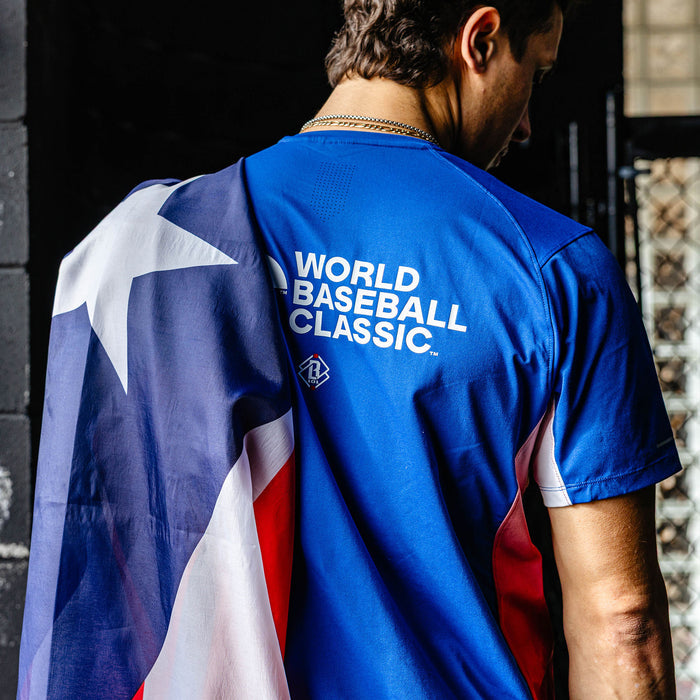 Adult model wearing blue Diamond Tech Vented Puerto Rico graphic tee