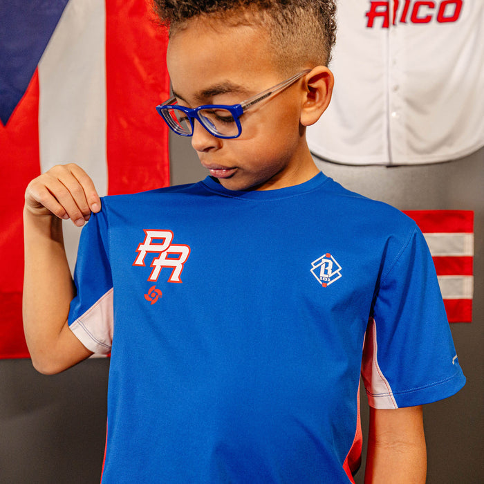 Youth model wearing blue Diamond Tech Vented Puerto Rico youth graphic tee