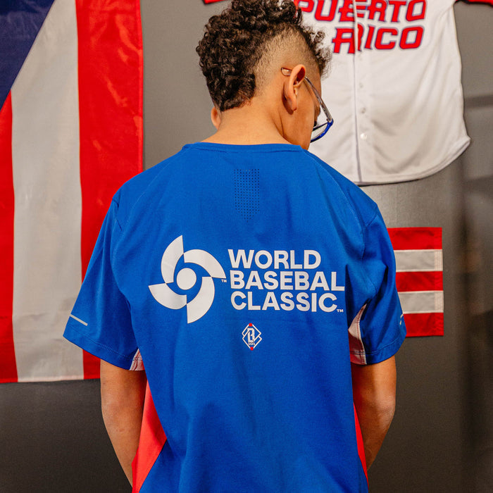 Youth model wearing blue Diamond Tech Vented Puerto Rico youth graphic tee