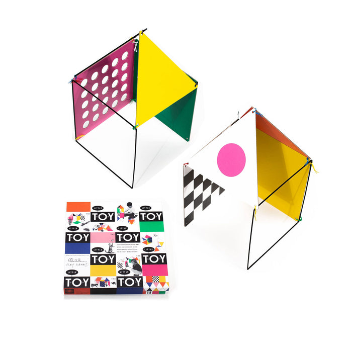 Colorful geometric toy set with packaging on a white background