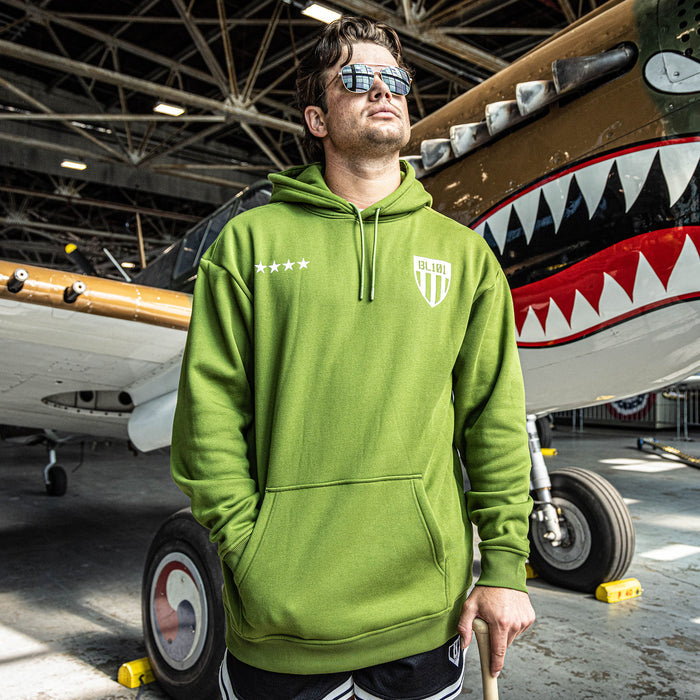 Man wearing Army green Hoodie with white BL101 armor design and five white stars in front of hoodie