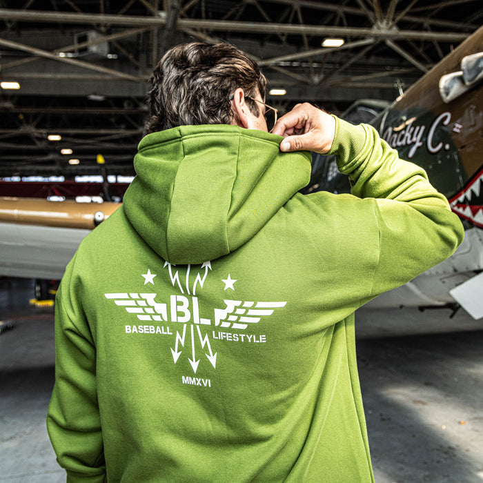 Man wearing Army green Hoodie with white Baseball Lifestyle BL wing design in middle of back