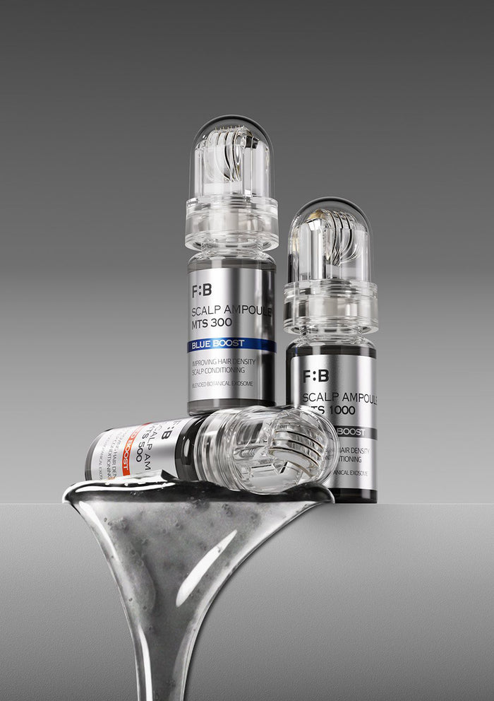 Three medical ampoules on a metallic surface with a gray background