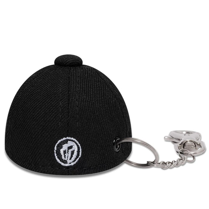 The model is wearing this Gettomasa X New Era Key Chain in black. 5