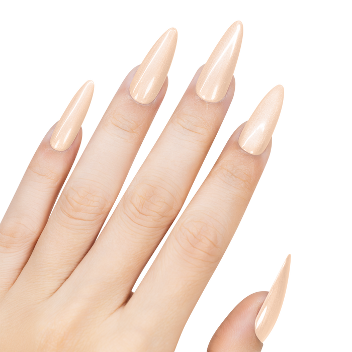 Hand with long, pointed, beige nails on a white background