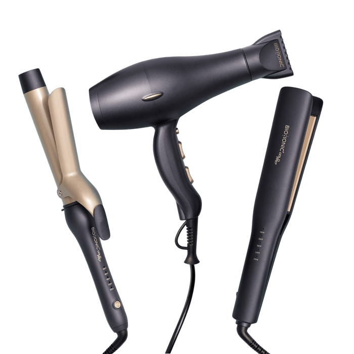 Set of hair styling tools including a curling iron, hair dryer, and straightener on a black background.